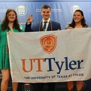 UT Tyler Archer Fellows Pose with Campus Flag